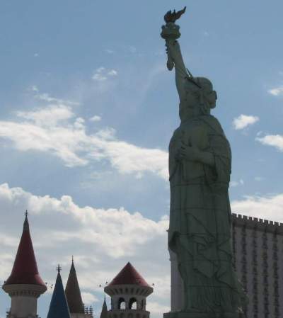 Statue of Liberty near a castle